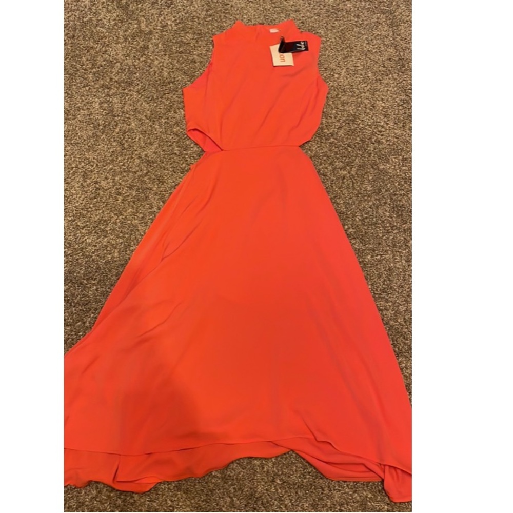 Coral dress with cutouts on the side